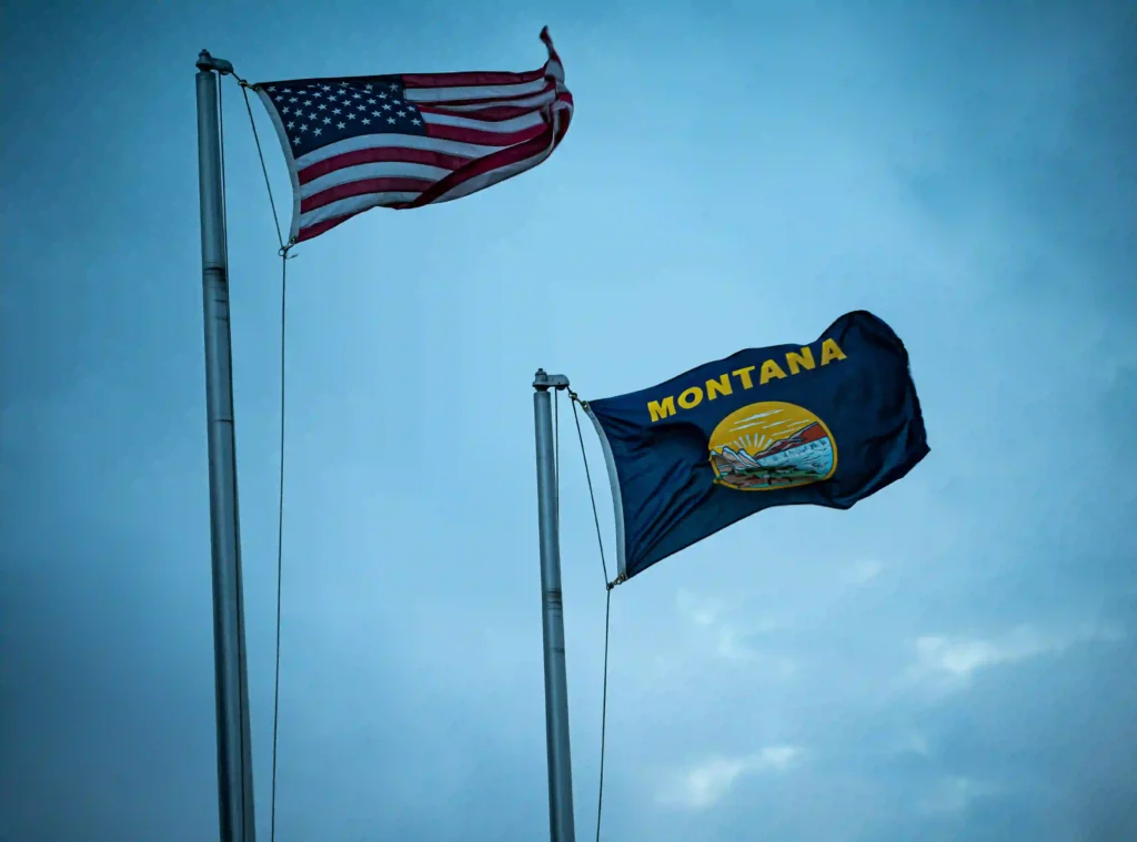 Renters Insurance Quotes in Montana (2026): Best & Cheapest Policies Montana state flag flying alongside the American flag — renters insurance quotes Montana